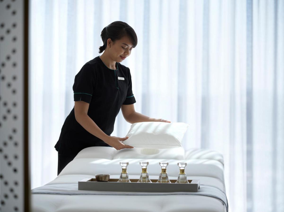Four Seasons Hotel Kuwait At Burj Alshaya Kuwait City Exterior photo A spa attendant making a bed